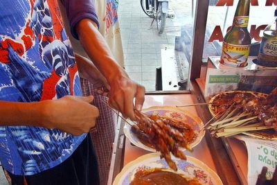 Man arrested for killing mother-in-law with poisoned chicken skewers delivered by courier