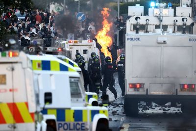 Rioting breaks out for second night near Belfast as masked protesters clash with police