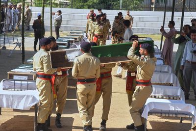A mass funeral is held for 22 Pakistani soldiers who died in a helicopter crash in Kashmir