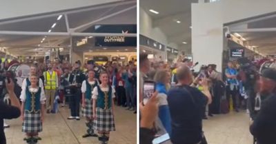 Tartan Army fans belt out Flower of Scotland before World Cup flights