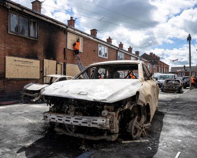Police fire plastic bullets in effort to contain racist riots in Northern Ireland