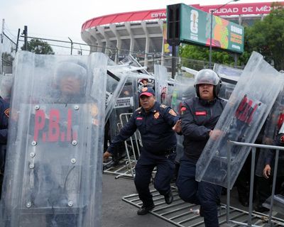 Petrol bombs and bricks hurled at Mexican police during pre-match unrest at Azteca