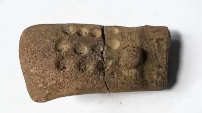 11 mysterious dots on a 2,700-year-old figurine are forcing archaeologists to rethink early writing in Guatemala