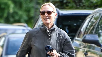 Zara Tindall's relaxed blue jeans and adidas trainers are a comfy combination that's perfect for unpredictable weather