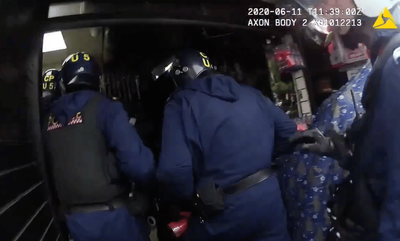 Moment police raid east London money store as they seize £2.5 million in cash and gold