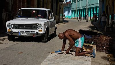Cuban president announces economic reforms to 'liberalise' the embargo-hit and blockaded island