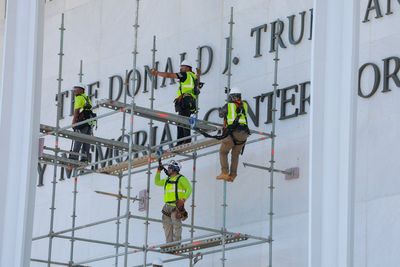 Crews begin work to remove Trump’s name from Kennedy Center after court ruling