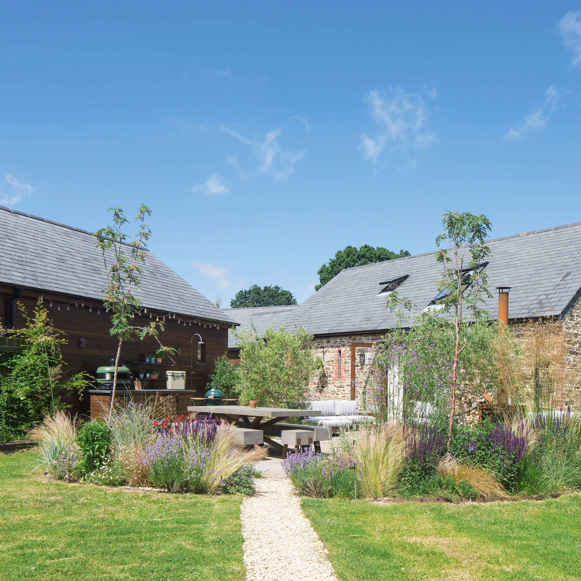 From a patch of undeveloped land to a cleverly zoned family garden, this couple has given new life to their outdoor space