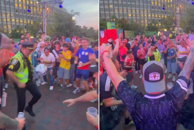 Scotland fans celebrate with Boston police officer as he shows off football skills