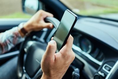 Hands-Free Laws Just Got Stricter — Holding Your Phone at a Red Light Can Cost You