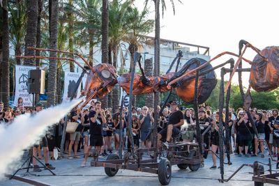 Giant ant puppets swarm streets of Spanish island in anti-tourism protest