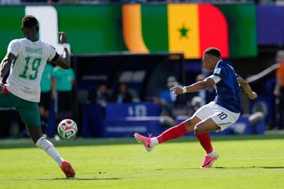 Mbappé’s belter steals show as fluid France see off late Senegal challenge