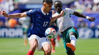 Mbappé breaks records as France see off spirited Senegal
