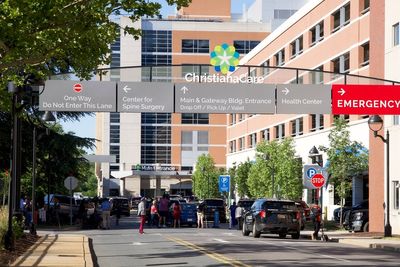 Suspect at large after hospital shooting leaves one dead