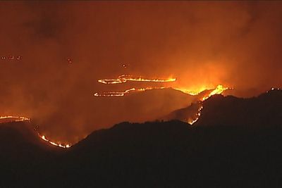 Wildfires burn through the night in California county