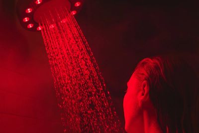 This shower head turns your daily rinse into a red light therapy session