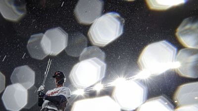 A sports photographer turned “torrential rain” into stunning mid-game portraits of the Detroit Tigers and Baltimore Orioles using a cheap ultra-wide lens