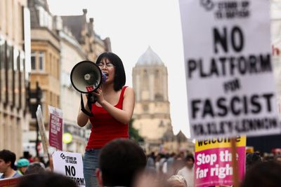 Protesters rally outside Oxford Union against Tommy Robinson debate