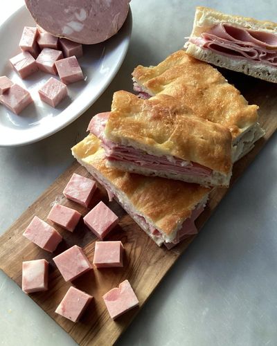 Rachel Roddy’s recipe for focaccia sandwiches with mortadella and parmesan cream