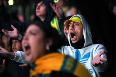 From nightclubs and worksites, fans in Sydney and Melbourne gathered before dawn to cheer on the Socceroos