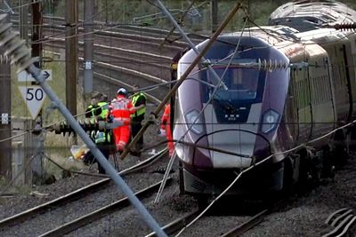 UK police probe cause of train collision that killed driver, left 9 in critical condition