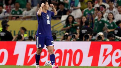 Ueda shines as Japan knocks out Tunisia in World Cup's 1,000th game
