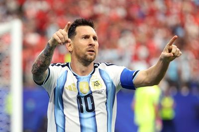 Argentina 2-0 Austria: Lionel Messi makes history as World Cup holders sail into knockout stages
