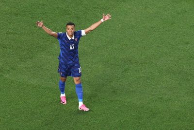 Kylian Mbappe makes a statement as France overcome two-hour storm delay to beat Iraq at World Cup
