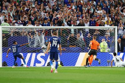Mbappe double sends France into knockout rounds after lengthy weather delay