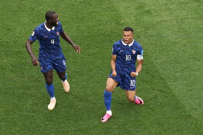 Mbappe chases Messi record as France overcome two-hour storm delay