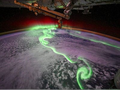 'Far too bright for my camera': French astronaut Sophie Adenot captures intense aurora dance beneath the space station