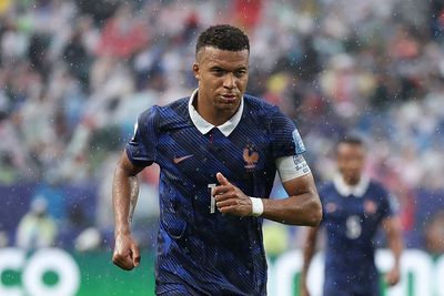 Why was the second half of France's game with Iraq delayed? And what did the players do to pass the time?