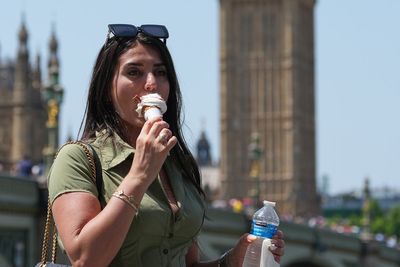 Britons stock up on fans, ice cream and silk scarves as intense heat grips country