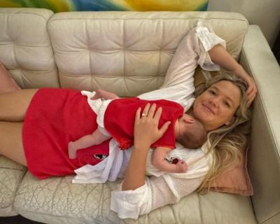 Sydney woman attacked by shark wakes briefly from coma to say three words