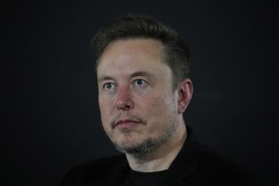 Elon Musk’s trillionaire status slips as SpaceX shares swing
