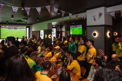 Pubs full, tools down and TV in the office: Australia readies for the ‘Great Socceroos Sickie’