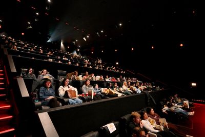 Gen Z’s newest fad is watching TV in movie theaters. Here’s why
