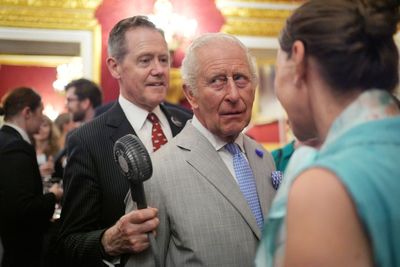 King Charles fanned by aide as guests feel the heat at climate event