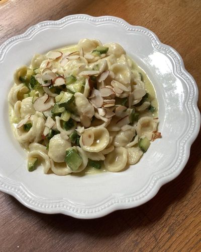 Rachel Roddy’s recipe for orecchiette with courgettes, parmesan cream and almonds