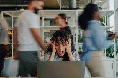 Happier going back to the office? One in five workers spend day without speaking to a colleague