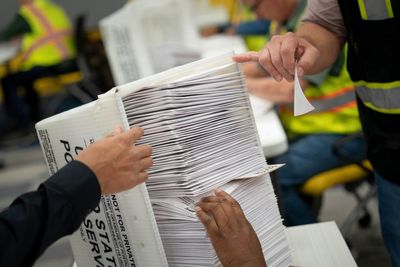 US judge blocks Trump administration’s bid to restrict mail-in voting