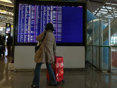 Japan cancels 120 flights as twin storms approach