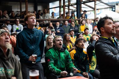 Packed pubs and skiving school: Australian fans nurse pints over laptops to cheer on Socceroos
