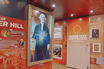 AI-generated George Washington run by conservative PragerU is featured on Trump’s ‘Freedom Truck’ as it tours US