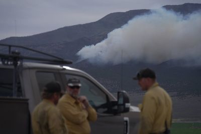 Fast-moving wildfire spreads through western US as restrictions put in place