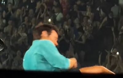 Harry Styles sparks concern at his Wembley gig as he chokes on water before falling to floor during London heatwave