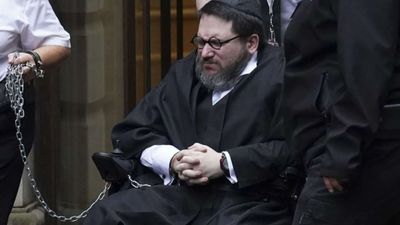 US convicted rapist who faked his death and fled to Scotland to avoid arrest dies in prison hospital