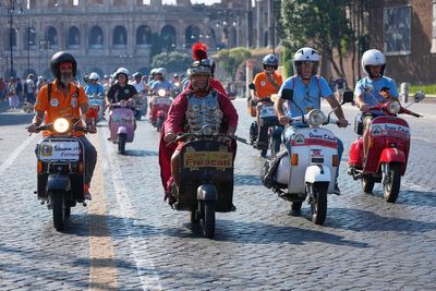 More than 15,000 Vespas from across the world swarm Rome as iconic scooter celebrates anniversary