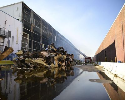 ‘Like a dead body’: after warehouse fire, LA residents say air thick with smell of rotting food
