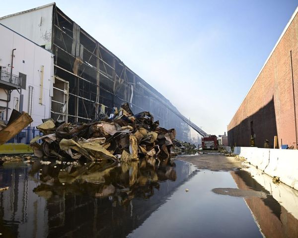 ‘Like a dead body’: after warehouse fire, LA residents say air thick with smell of rotting food